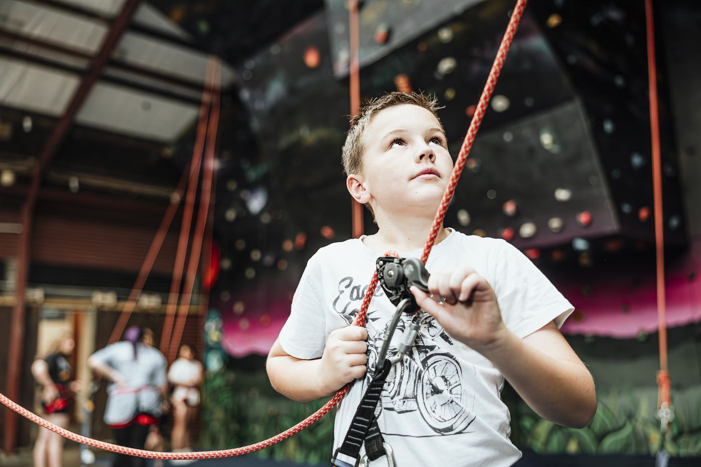 A climber clipping into the belay rope